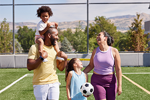 Smiling family on soccer field